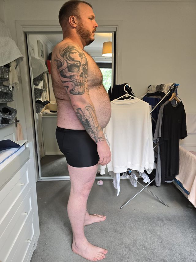Andrew East at 150 kilograms, side profile